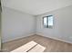 Simple bedroom with wood flooring and a window at 4141 N 31St St # 414, Phoenix, AZ 85016