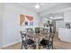 Bright dining area features a round wooden table and four black chairs at 4141 N 31St St # 414, Phoenix, AZ 85016