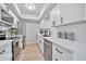 Modern kitchen with white cabinets, stainless steel appliances, and quartz countertops at 4141 N 31St St # 414, Phoenix, AZ 85016