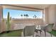 Private patio with seating area and view of palm trees at 4141 N 31St St # 414, Phoenix, AZ 85016