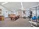 Community recreation room with gym equipment and a pool table at 4141 N 31St St # 414, Phoenix, AZ 85016