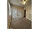 Bright bedroom featuring double door closet and carpet at 4544 N 129Th Ave, Litchfield Park, AZ 85340