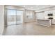 Kitchen opens to Gathering room with sliding glass door to backyard at 5017 E Anderson Dr, Scottsdale, AZ 85254