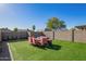 Artificial turf backyard with seating area at 5209 W Mauna Loa Ln, Glendale, AZ 85306