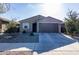 One-story house with a two-car garage and desert landscaping at 6753 W Southgate Ave, Phoenix, AZ 85043