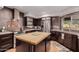 Updated kitchen with butcher block island and copper backsplash at 7656 E Aster Dr, Scottsdale, AZ 85260