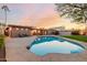 Relaxing kidney shaped pool and patio area at 7656 E Aster Dr, Scottsdale, AZ 85260