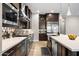 Modern kitchen with stainless steel appliances and dark wood cabinetry at 8602 W Artemisa Ave, Peoria, AZ 85383