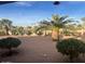 Landscaped backyard with desert plants at 9190 W Wenden Dr, Arizona City, AZ 85123