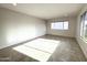 Bright living room with tile floors and large windows at 10956 W Meade Dr, Sun City, AZ 85351