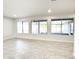 Bright living room with tile floors and large windows at 10956 W Meade Dr, Sun City, AZ 85351