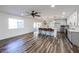 Modern kitchen with island, white cabinets, and hardwood floors at 12635 N Sun Valley Dr, Sun City, AZ 85351