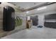 Garage interior with wall storage and wood paneling at 1312 E Coyote Pass -- # 186, Carefree, AZ 85377