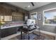 Home office with wood wall and standing desk at 1312 E Coyote Pass -- # 186, Carefree, AZ 85377