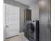 Convenient laundry room with washer, dryer, and cabinets at 1312 E Coyote Pass -- # 186, Carefree, AZ 85377