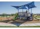 Modern playground with shade structure and play equipment at 17642 W Pierson St, Goodyear, AZ 85395