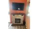 Stone fireplace with a mounted TV above at 2176 S Cherokee Ave, Apache Junction, AZ 85119