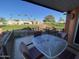 Covered patio with seating area and view of grassy area at 2176 S Cherokee Ave, Apache Junction, AZ 85119