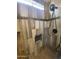 Modern shower with gray tile, grab bars, and built-in seat at 2176 S Cherokee Ave, Apache Junction, AZ 85119