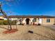 Single-story house with a landscaped yard and a well-maintained lawn at 2527 N 61St Ave, Phoenix, AZ 85035