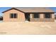 Single story home with brown roof and stone accents at 25883 W Denver Hills Dr, Wittmann, AZ 85361