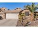 One-story home with a two-car garage and desert landscaping at 3026 W Windsong Dr, Phoenix, AZ 85045