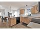 Bright kitchen with light wood cabinets, island, and modern appliances at 3926 E Potter Dr, Phoenix, AZ 85050