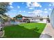 Spacious backyard with lush lawn and pool at 4015 E Catalina Dr, Phoenix, AZ 85018