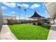 Large backyard with pool, grass, and shade sails at 4015 E Catalina Dr, Phoenix, AZ 85018