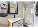 Clean bathroom with single sink, shower and wood vanity at 4015 E Catalina Dr, Phoenix, AZ 85018