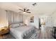Bright bedroom with king-size bed and access to another room at 4015 E Catalina Dr, Phoenix, AZ 85018