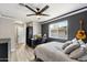 Cozy bedroom with a bed, desk, and guitar at 4015 E Catalina Dr, Phoenix, AZ 85018