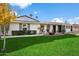 Beautiful ranch home with a well-manicured lawn and firepit at 4015 E Catalina Dr, Phoenix, AZ 85018