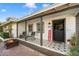 Inviting front porch with rocking chairs and patterned tile floor at 4015 E Catalina Dr, Phoenix, AZ 85018