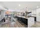 Spacious kitchen with marble island, stainless steel appliances, and stylish lighting at 4015 E Catalina Dr, Phoenix, AZ 85018