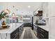 Sleek kitchen with marble countertops, modern cabinetry, and a large island at 4015 E Catalina Dr, Phoenix, AZ 85018