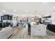 Modern kitchen boasting a large island, white cabinets, and a marble countertop at 4015 E Catalina Dr, Phoenix, AZ 85018