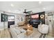 Spacious living room featuring a modern fireplace and stylish decor at 4015 E Catalina Dr, Phoenix, AZ 85018