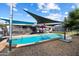 Relaxing kidney-shaped pool with shade sails at 4015 E Catalina Dr, Phoenix, AZ 85018