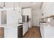 Modern kitchen with white cabinets, stainless steel appliances and hardwood floors at 41817 N Bridlewood Way, Phoenix, AZ 85086