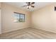 Spacious bedroom featuring a window with blinds and ceiling fan at 45335 W Rhea Rd, Maricopa, AZ 85139