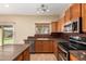 Spacious kitchen with stainless steel appliances and an island at 45335 W Rhea Rd, Maricopa, AZ 85139