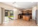 Eat-in kitchen with island and sliding door to backyard at 45335 W Rhea Rd, Maricopa, AZ 85139