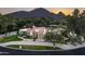 Luxury home with pool, mountain views, and landscaped grounds at 6301 E Huntress Dr, Paradise Valley, AZ 85253