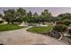 Landscaped backyard oasis with pool, patio, and putting green at 6301 E Huntress Dr, Paradise Valley, AZ 85253