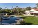 Inviting pool and spa surrounded by a beautifully landscaped backyard at 6301 E Huntress Dr, Paradise Valley, AZ 85253