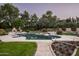 Beautiful pool with a fountain and lush landscaping at 6301 E Huntress Dr, Paradise Valley, AZ 85253