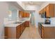 View of the kitchen with oak cabinets, stainless steel appliances, and tile floors at 680 E Gail Dr, Chandler, AZ 85225