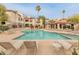 Community pool with lounge chairs and a spa at 9415 E Purdue Ave # 187, Scottsdale, AZ 85258