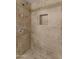 Clean shower with neutral tile and built-in niche at 9415 E Purdue Ave # 187, Scottsdale, AZ 85258